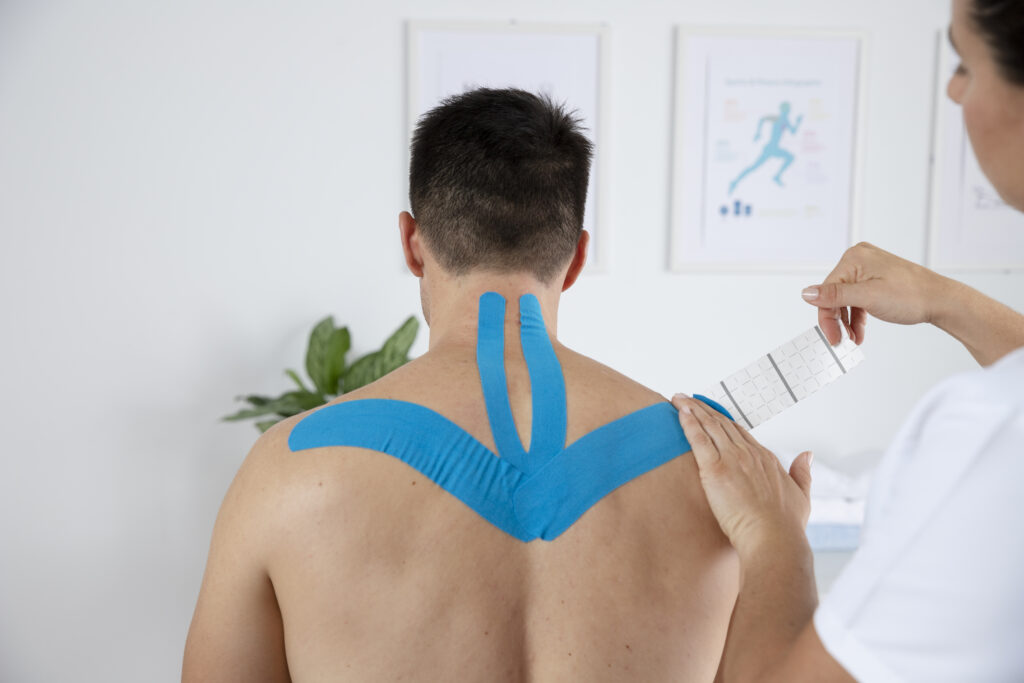 female-physiotherapist-applying-elastic-medical-bandage-male-patient (1)